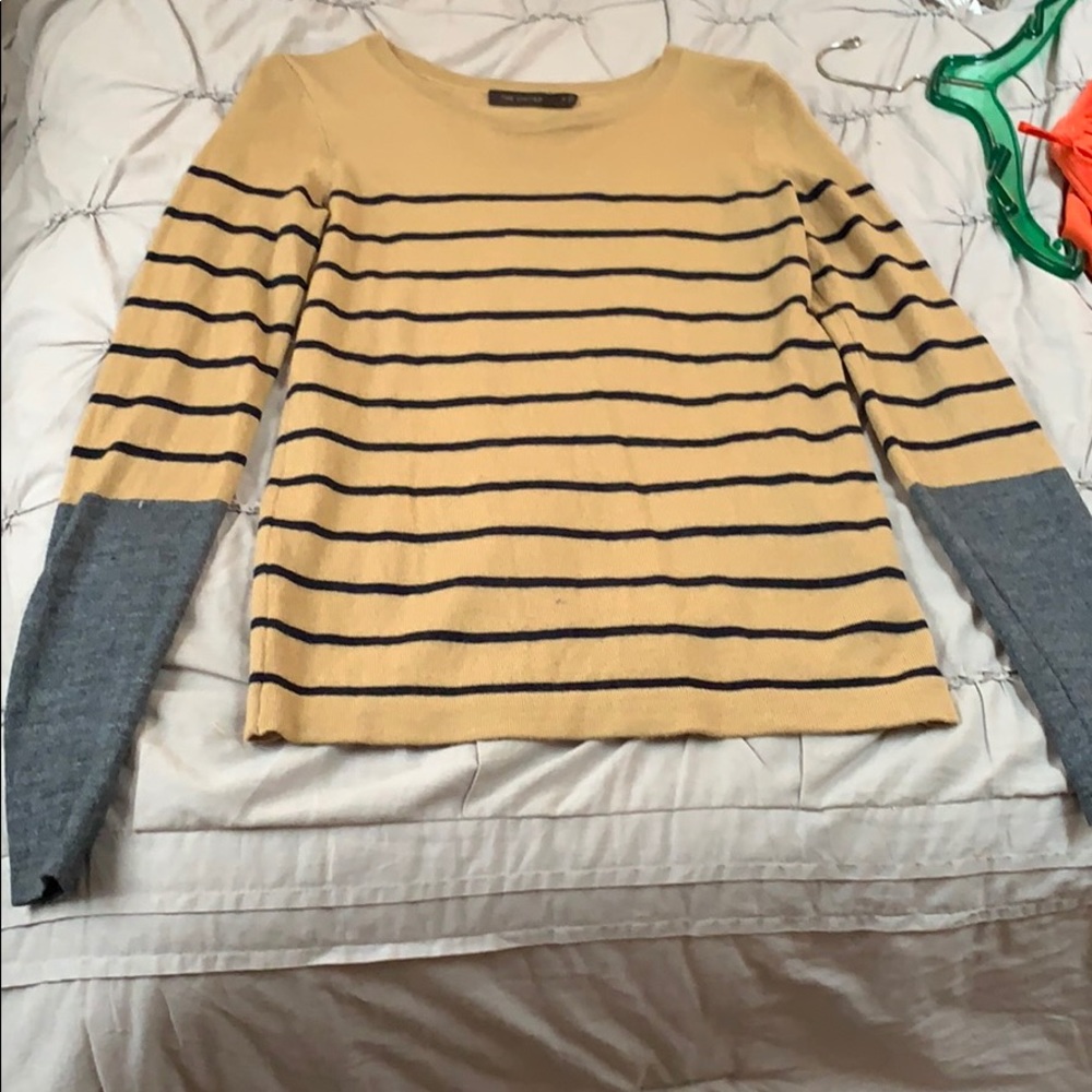 The limited sweater in M, fits tighter